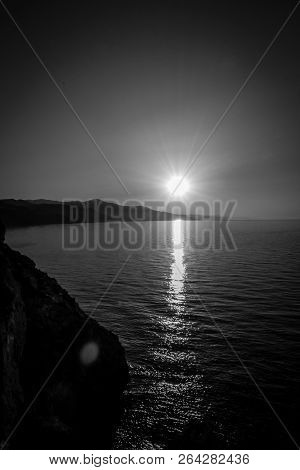 Jebha Sunset Island And Waves And Rocks
