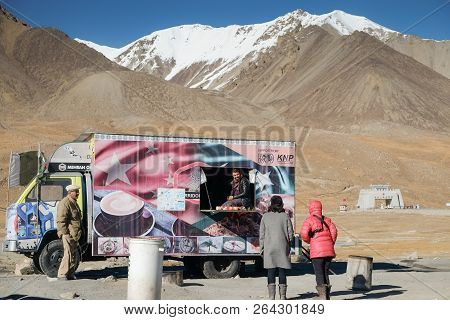 Khunjerab Pass, Pakistan. October 30,2017 : Women Tourists Talking With A Man Selling Food At The Pa
