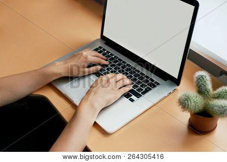 Young Women Working On Her Laptop With Blank Copy Space Screen For Your Advertising Text Message In 