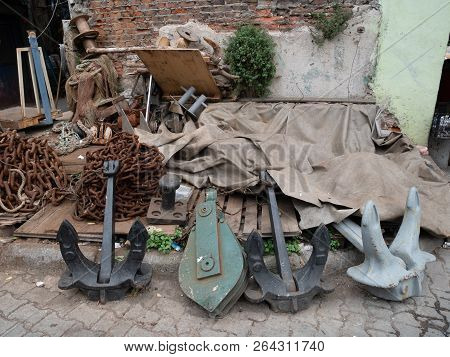 Few Big Anchors With Chains Lay On The Ground