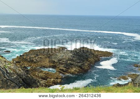 Views Of The Bay With The Waves Breaking On Its Rocks At Tapia De Casariego. Nature, Travel, Recreat