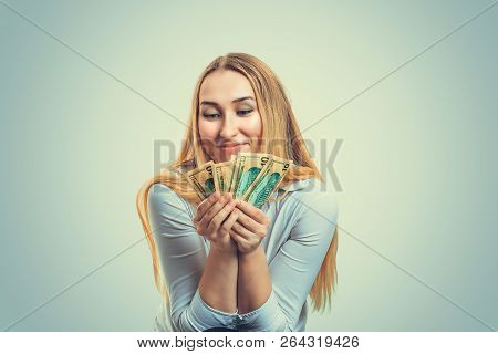 Charming Blond Woman Holding Heap Of Dollar Bills Happy With Finances