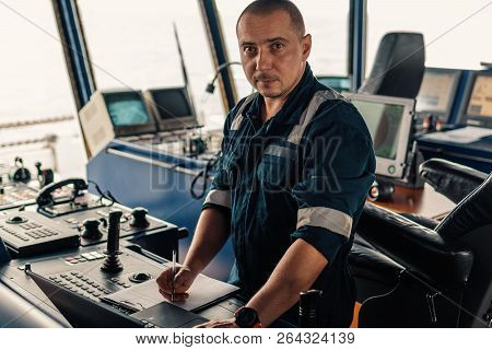Marine Navigational Officer Is Using Laptop Or Notebook At Sea