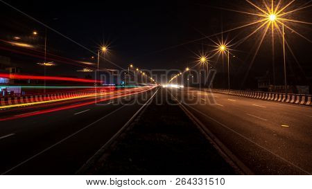 Fast Driving Vehicles Trial At Night, With Long Exposure Blurred Effect At Indian Nation Highway 19 