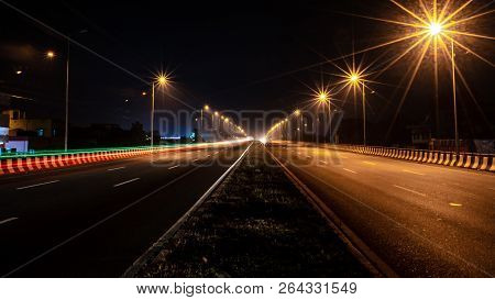 Fast Driving Vehicles Trial At Night, With Long Exposure Blurred Effect At Indian Nation Highway 19 