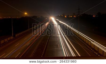 Fast Driving Vehicles Trial At Night, With Long Exposure Blurred Effect At Indian Nation Highway 19 