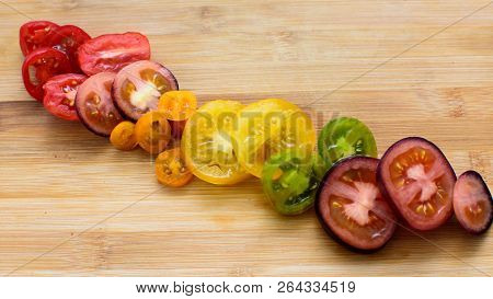 Tomato Sliced Colorful Beautiful Vibrant Colored Rainbow Of Sliced Organic Heirloom Tomatoes In Mult