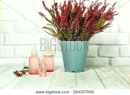 Bouquet Of Heather And Tincture Of Heather Flowers On Light Background, The Concept Of Healing Plant