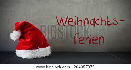 Santa Hat, Text Weihnachtsferien Means Christmas Holidays