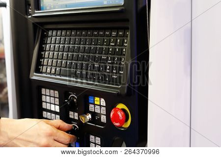 Operator Working With Cnc Lathe Machine Using Control Panel. Selective Focus.