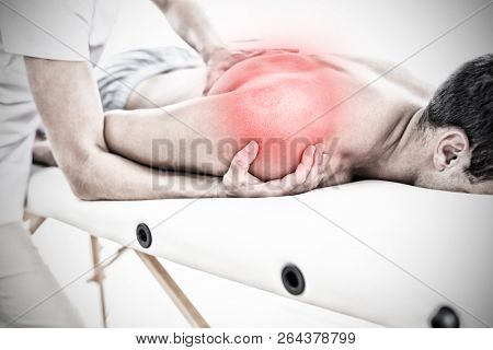 Highlighted pain against physical therapist examining massaging