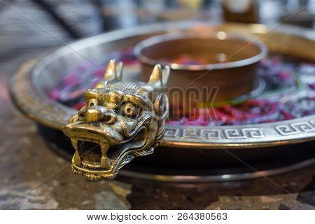 Chengdu Sichuan Hot Pot Close Up With Dragon Head Sculpted Handles, Chenggdu, Sichuan Province, Chin