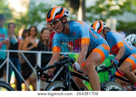 Boise, Idaho - July 14, 2018: Woman On A Bike Racing Through Boise In The Twilight Criterium