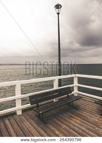 Wooden Pier On The Cloudy Day. Seaview