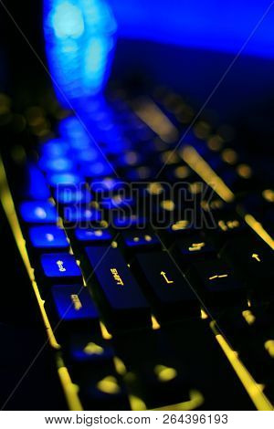 computer illuminated rgb keyboard in the dark