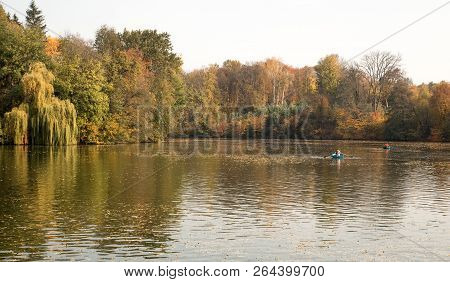 Boats On The Lake In Colorful Autumn Park, Trres Reflection In Water