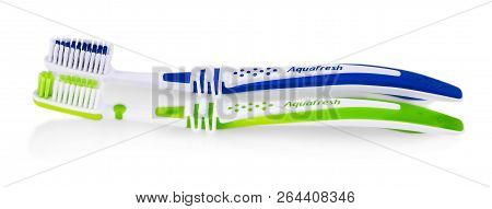 The Two Toothbrushes Aquafresh On White Background