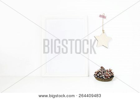 Vertical White Blank Wooden Frame Mockup. Pine Cones In Vintage Metal Bowl, White Table And Wooden S
