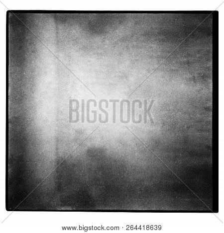 Black And White Medium Format Film Background With Grain And Light Leak. Blurry Unfocused Background