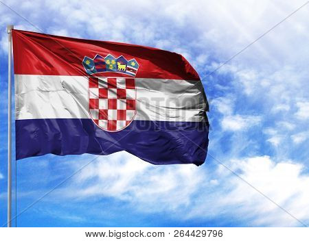 National Flag Of Croatia On A Flagpole In Front Of Blue Sky