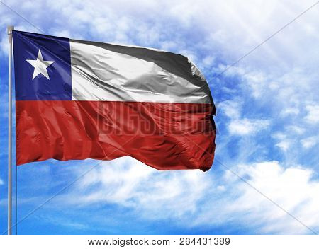 National Flag Of Chile On A Flagpole In Front Of Blue Sky