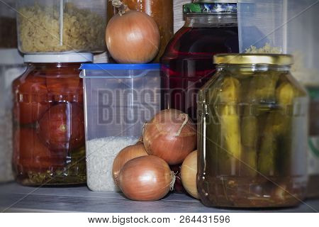 Storage Shelves In Pantry With Homemade Canned Preserved Fruits And Vegetables