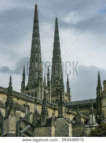Tourist Passing The Famous Cathedrale Saint-andre De Bordeaux , France