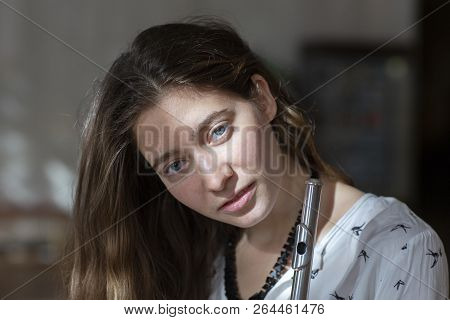 Girl Plays On Flute. Flute In Hands Of Girl During The Concert. Professional Musician Playing On Flu