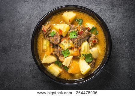 Goulash With Meat And Vegetables On Black Background. Beef Stew With Vegetables. European Cuisine. T