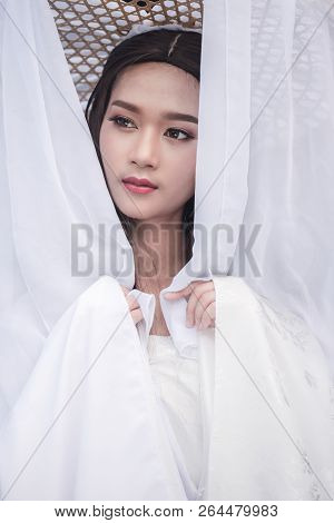 Close Up Portrait Beautiful Chinese Woman White Dress Traditional, Beautiful And Belligerent Face; A