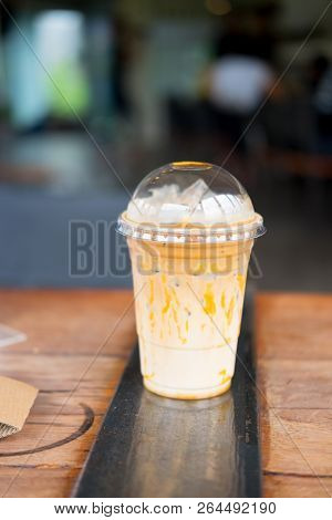 Iced Caramel Macciato Coffee With Milk. Cold Sweet Refreshing Summer Drink Concept
