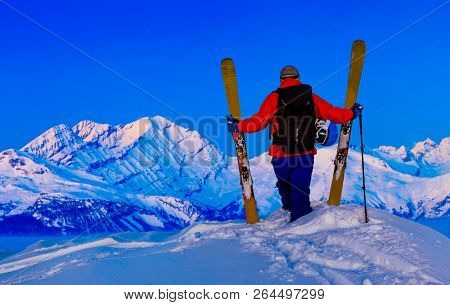 Skitouring with amazing view of swiss famous mountains in beautiful winter powder snow of Alps. 