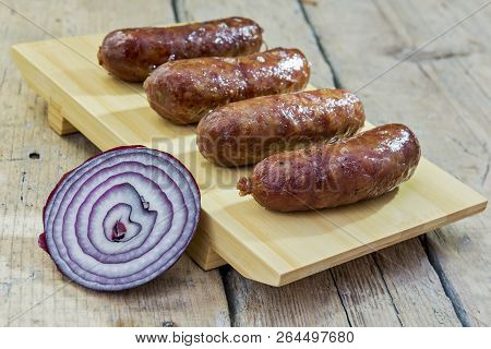 Grilled Sausages On Cutting Board