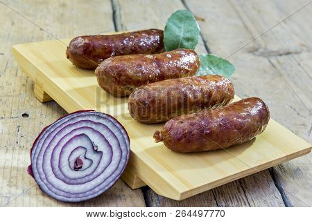 Grilled Sausages On Cutting Board