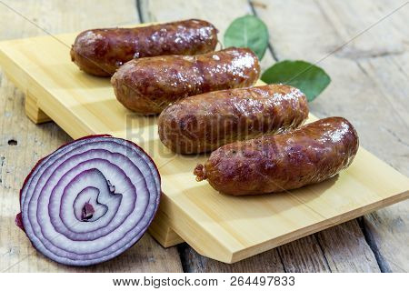 Grilled Sausages On Cutting Board