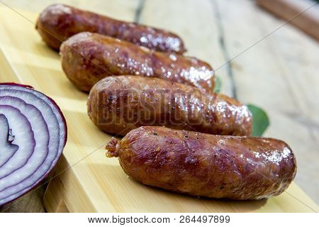 Grilled Sausages On Cutting Board
