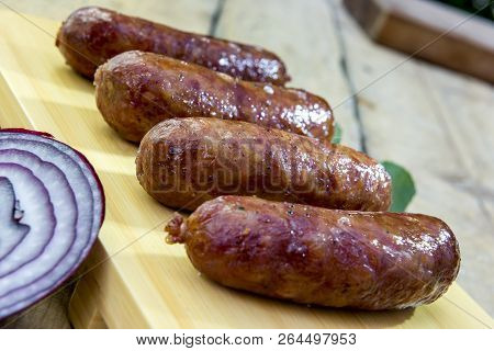 Grilled Sausages On Cutting Board