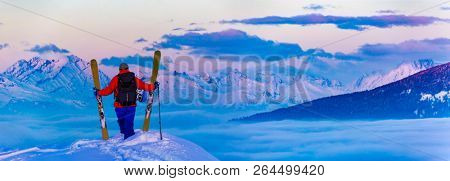 Skitouring at sunset with amazing view of swiss famous mountains in beautiful winter powder snow of Alps. 