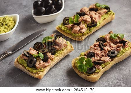 Bruschetta With Tuna, Olives And Avocade Spread.