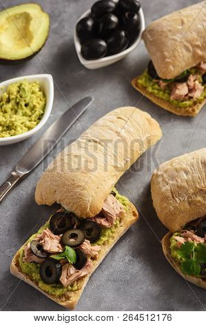 Bruschetta With Tuna, Olives And Avocade Spread.