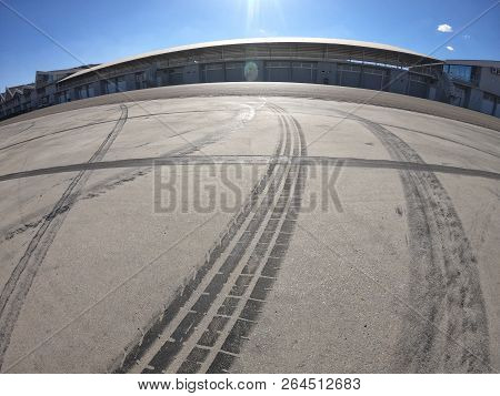 Wheel Marks On Concrete And On The Pavement After Drifting On A Sunny Day
