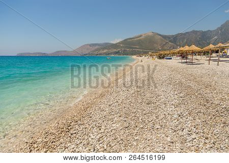 Borsh, Albania- 29 June 2014: Sunbathers On The Beach In Borsh Resort. Stony Beach On The Adriatic S