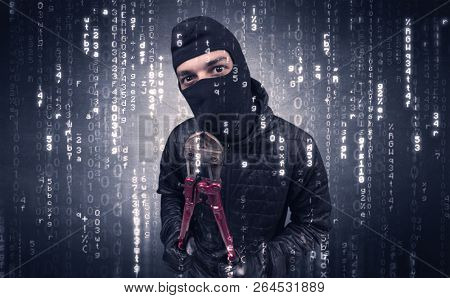 Burglar in action with encoded concept and his tools in his hand. 
