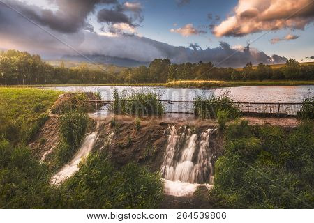 Strba Pond Lit By Golden Light At Sunset With High Tatras Mountains In Background, Slovakia.