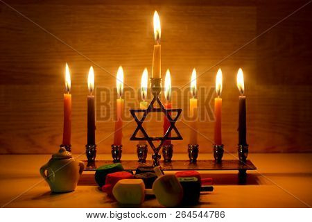 Hanukkah Is A Jewish Holiday. Burning Chanukah Candlestick With Candles. Chanukiah Menorah. Dreidel,