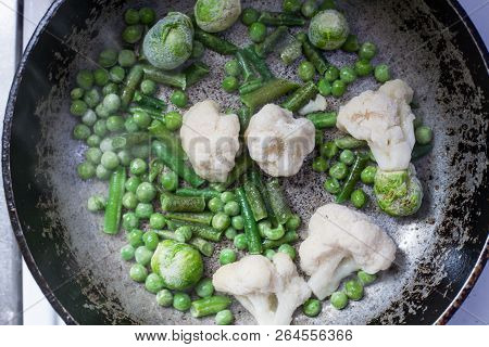 Vegetarian Fried Cauliflower In A Frying Pan With Bread Crumb And Butter On Frying Pan