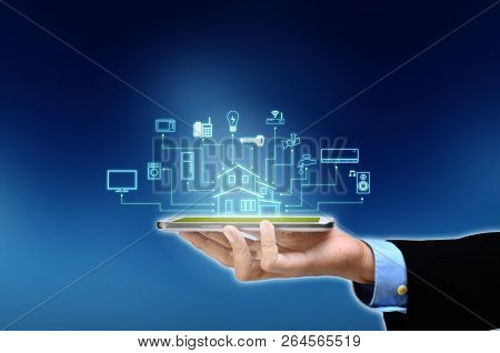 Internet Of Things And Smart Home Concept. Controlling Everything With A Smart Phone Or Gadget Using