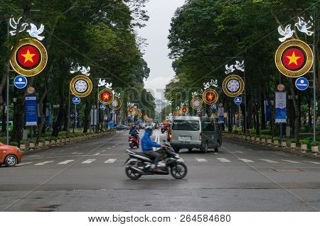 Ho Chi Minh City, Vietnam - August 23, 2017: Moving Traffic Crossing The Street In Hcmc In Vietnam