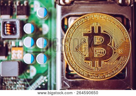 Bit Coin Placed On The Electronics. Evolutionary Concept In Finance