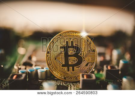 Bit Coin Placed On The Electronics. Evolutionary Concept In Finance